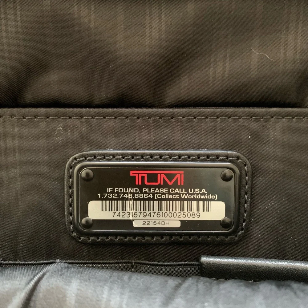 Tumi Black Travel Bag with Adjustable Strap